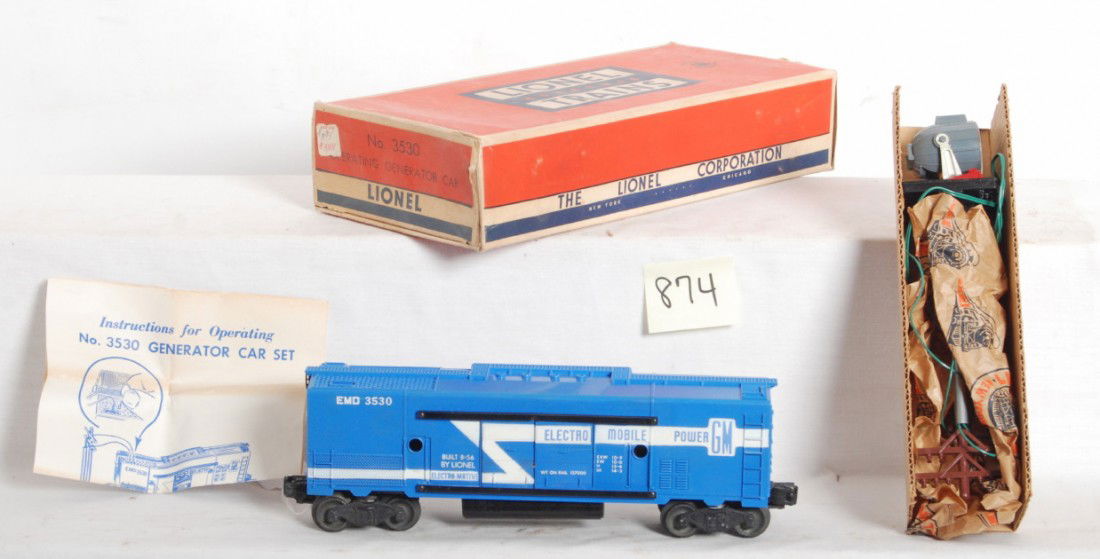 Lionel 3530 operating generator car in OB Mint: Postwar Lionel O gauge 3530 EMD operating generator car, full stripe version with black fuel tanks and black pole base variations. Car is unrun C9. OB is better C7-8 with price sticker.