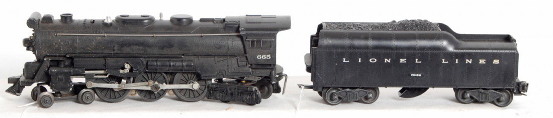 Lionel 665 steam loco and 2046W whistle tender: Postwar Lionel O gauge 665 steam locomotive with 2046W whistle tender. Loco has dinged pilot step corner, otherwise train should clean and polish to look sharp C7.