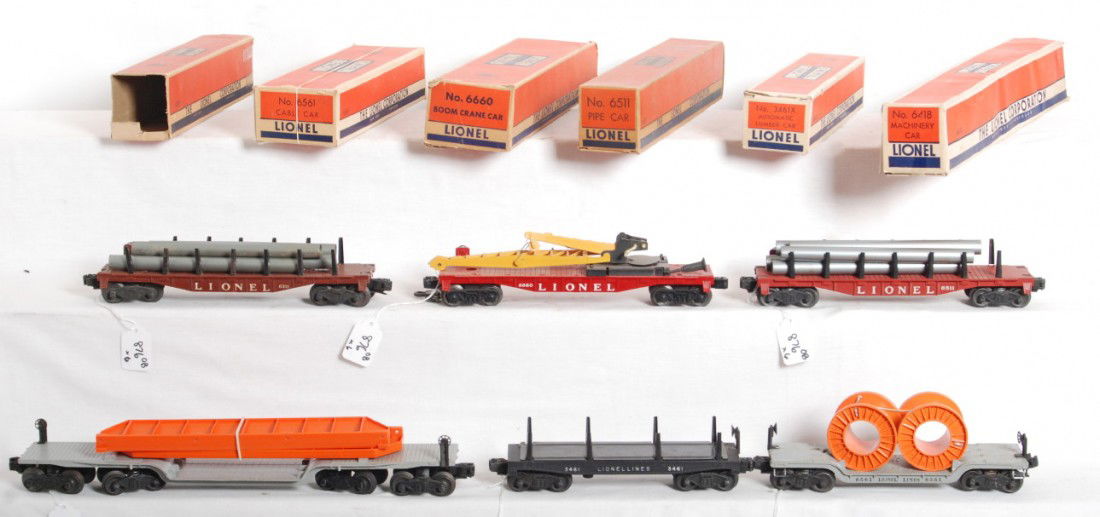 Lionel 6311, 3461X, 6660, 6418, 6561, 6511 in OB: Postwar Lionel O gauge 6311 pipe car, 3461X automatic lumber car, 6660 boom crane car, 6418 machinery car w/two girders, 6561 cable car (touchups), 6511 pipe car. Trains should clean to look very nice