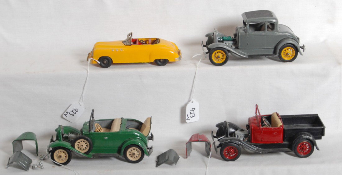 Four Hubley cars, three kits, Kiddie Toy 465: Four Hubley diecast cars. Three roadster/pickup truck kits assembled with some missing parts. Kits are painted. Kiddie Toy No. 465 Buick? diecast car, C8 area. Kits are sold as shown in our photos wit