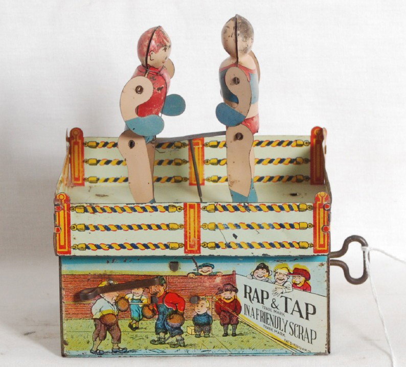 Unique Art Rap & Tap in a friendly scrap tinplate : Unique Art Rap & Tap in a friendly scrap, mechanical windup tinplate toy. Two looks C6 area, with a loose tab and one missing tab. Toy functions correctly.