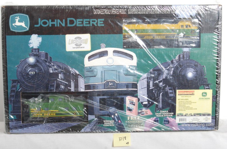 MTH John Deere set with Locosound: MTH Railking modern O Gauge John Deere ready to run set in OB. Set number is 30-4074-0. Set features diesel locomotive with Locosound and three cars. Set is sealed in factory plastic and assumed C9-10