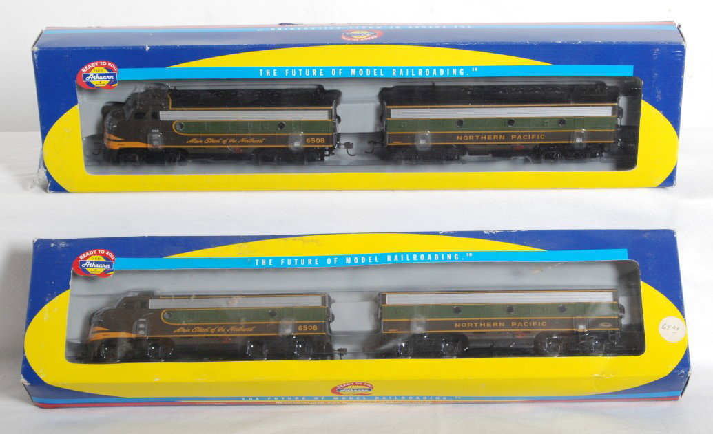2 pairs Athearn Northern Pacific F7 A-B: Athearn modern HO diesel locomotives in OBs. Includes two pairs of 8027 Northern Pacific F7 A-B pairs. Locos are NOS and assumed C9-10. Box ends show wear and some rips.