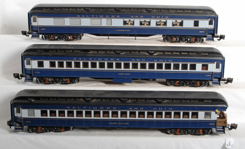 Three G scale Baltimore and Ohio passenger cars: Modern era G scale Baltimore and Ohio passenger cars, 1302 Deer Park coach, 1402 Daniel Willard observation, and 1502 Cumberland diner with rust on underside parts, couplers, trim, etc. Items in this 