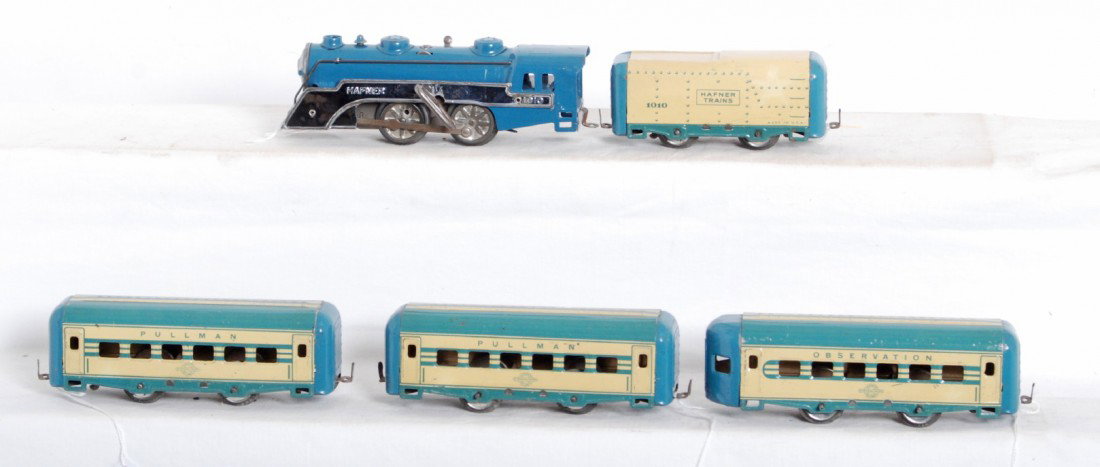 Hafner 1010 loco and tender, 2-Pullmans, obs. pas: Hafner O gauge mechanical tinplate No. 1010 steam locomotive and tender with two Pullman coaches and an observation car. Trains are very clean and shiny C6+.