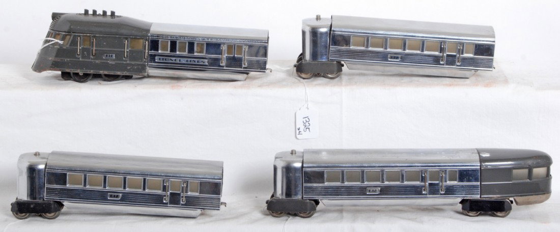 Lionel Lines Flying Yankee streamline diesel pass: Prewar Lionel O gauge Flying Yankee articulated streamline diesel passenger train with 616 powered unit, two 617 coaches, and a 618 observation car. Observation end of 618 and roof of 616 are repainte