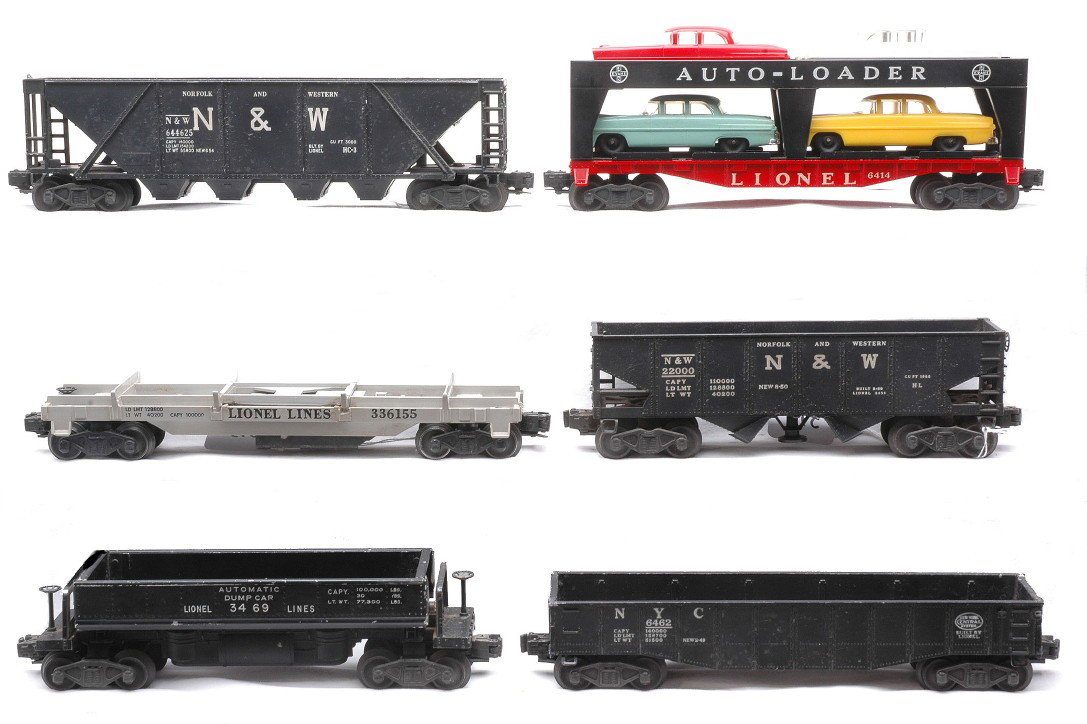 Lionel Freights 6446-25 3456 6462 3361 3469 6414: Lionel postwar freight cars; 6446-25 Norfolk & Western hopper, 3456 Norfolk & Western hopper, 6462 New York Central gondola, 3361 flatcar missing load, 3469 automatic dump car and a 6414 Evans auto lo