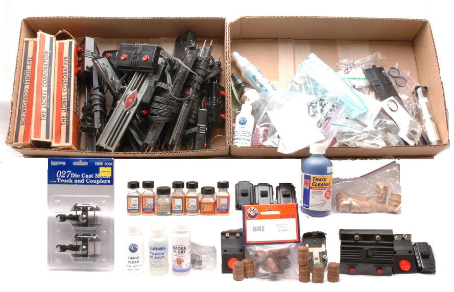 Selection Lionel Parts and Accessories: A selection of Lionel accessories including; 364C and no. 90 controllers, 167 whistle controller, wires, LTC track connector, wooden barrels, smoke pellets and fluid, track cleaning fluid and 6019 rem