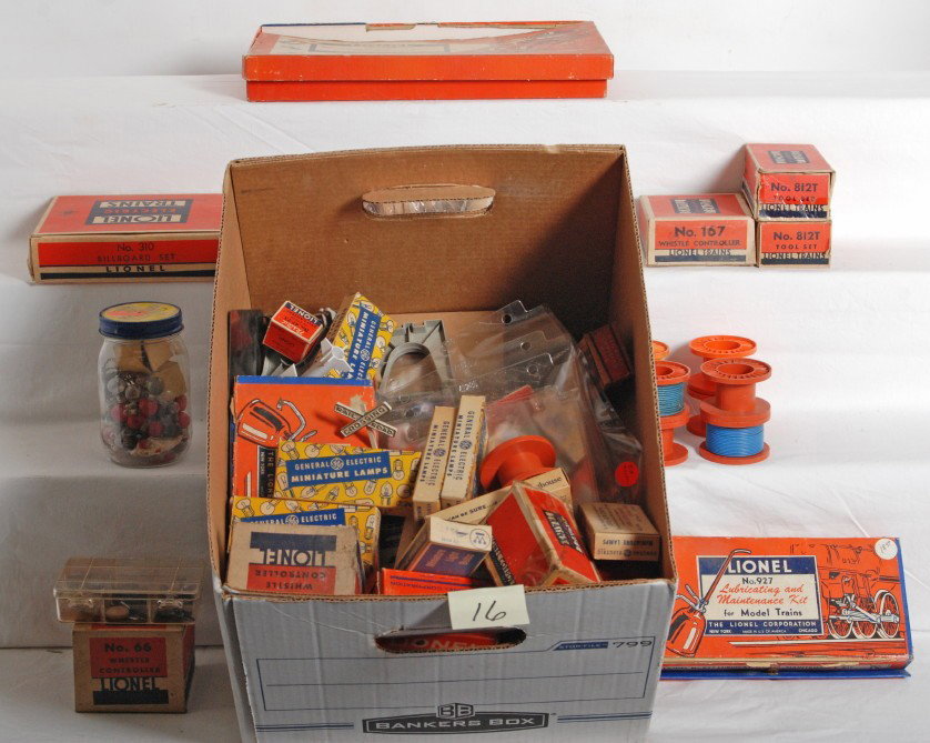 Lot of Lionel postwar pieces, parts, components, et: Huge lot of most postwar Lionel O gauge parts, pieces, components, light bulbs, trestles, 310 billboard sets, 812T tool set empty boxes, connectors, loose billboards, metal Lionel logo stick-ons, larg