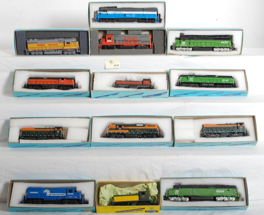 13 Athearn HO locomotives BN, UP, Milwaukee, etc: Athearn modern HO diesel locomotives in OBs. Thirteen locomotives including road names such as Burlington Northern, Union Pacific, Milwaukee Road, etc. There is a mix of road units and yard switchers.
