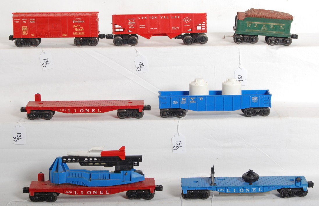 Lionel 6476, 6414, 638-2361, 6650, 3409, 6162, 187: Postwar Lionel O gauge Nos. 6476 LV hopper, 6414 flatcar, 638-2361 Van CampÕs w/coin slot, 6650 missile launcher, 3409 helicopter launching flatcar, 6162 New York Central gondola, 1872T Western and A
