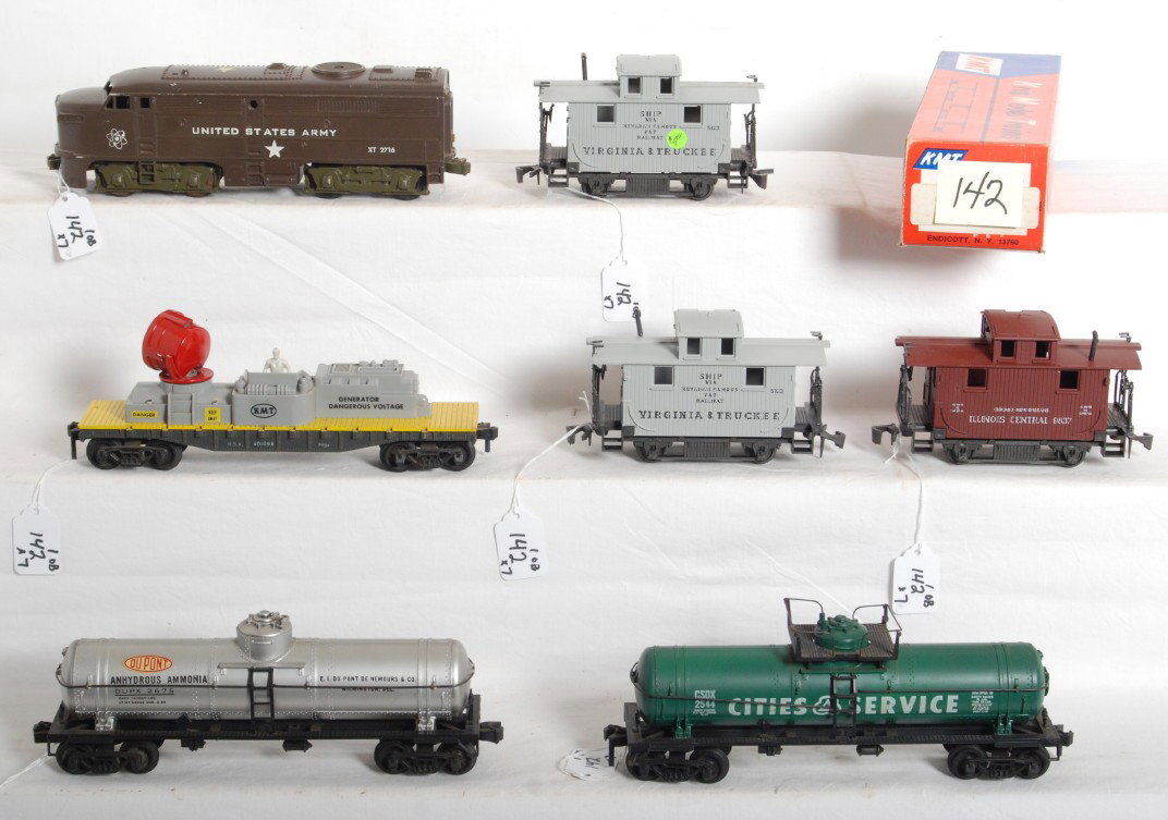 KMT, Auburn, Kusan, Atlas 2-rail O scale diesel tr: Seven postwar/modern era 2-rail O scale trains nice C6-7. Kusan United States Army XT2716 Alco diesel A unit. KMT Kris Model Trains 401098 track maintenance car (missing one pivot for searchlight head