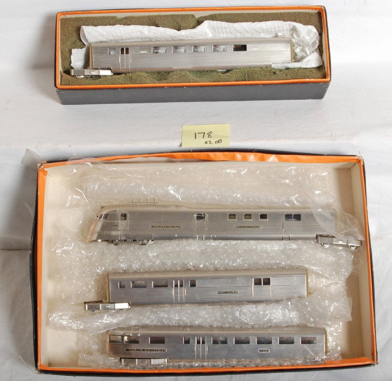 Nickel Plate HO Brass Burlington Zephyr set: Nickel Plate Products modern HO brass Burlington Zephyr set in two OBs. Includes powered unit, RPO, coach, and observation. Trains are C8 with some run time. OBs are very worn, but still together with