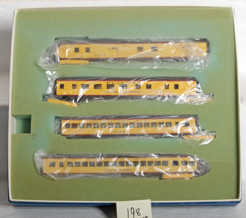 AHM Union Pacific brass M-10000 set: AHM modern HO brass Union Pacific M-10000 passenger set in OB. Includes powered unit, two coaches, and observation. Catalog number is #431. Set is high C8 with very light signs of run time. OB has ver