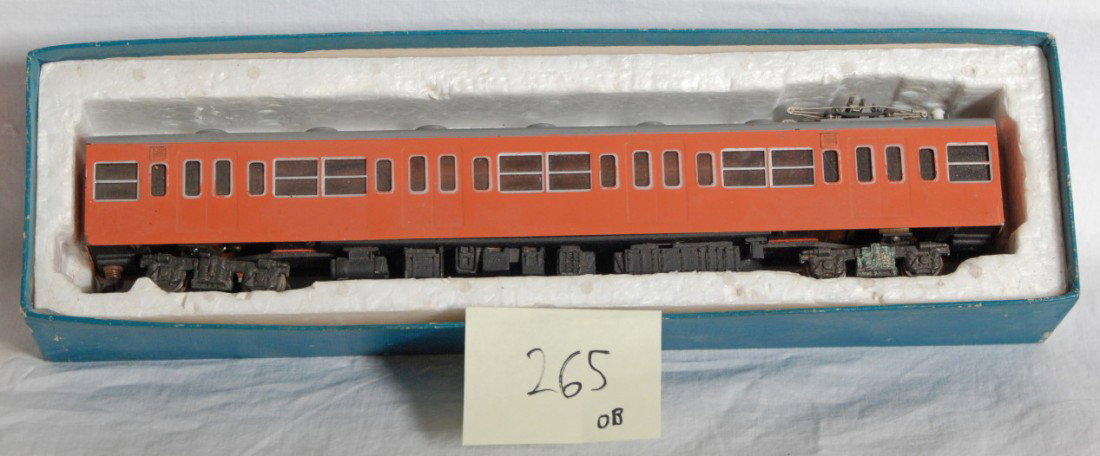Katsumi 103 powered passenger car: Katsumi KMT modern HO brass powered passenger car in OB. Number marked on the end of the box is 103. Model is C8 condition with some run time. OB is missing lid and has some wear.