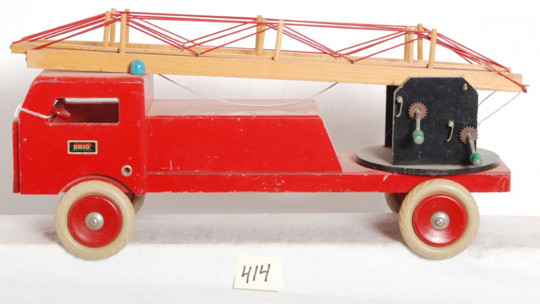 Brio wooden aerial ladder fire truck: Brio wooden aerial ladder fire truck with some chips/splits to ladder section ends and four ladder rungs are cracked/split. Please view the photographs for the best description and as to the condition