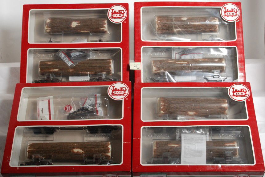 Four LGB 45770 skeleton log cars in OB: Modern era LGB G scale lot of four 45770 skeleton log car twin pack, one pack is missing a log. Trains otherwise look C8-10. Boxes show very light to mild wear.