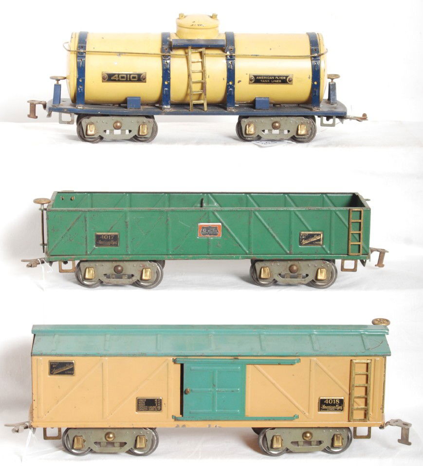 American Flyer 4010, 4017, 4018 wide gauge freight: Prewar American Flyer wide/standard gauge freight cars, C5-6. 4010 tank, 4017 sand, and 4018 boxcar. Sand car is missing a brake wheel.