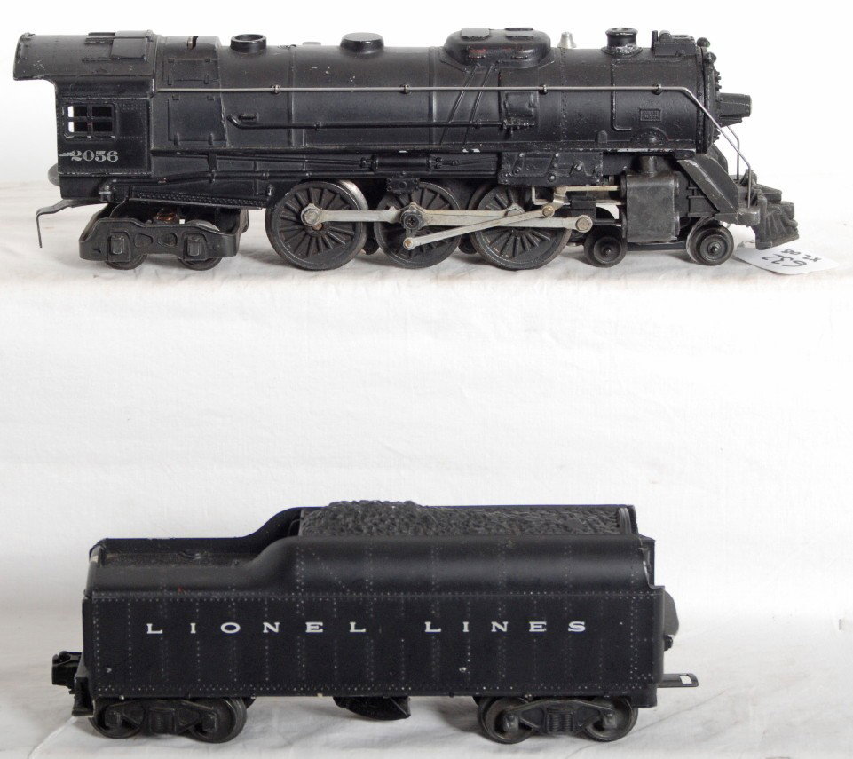 Lionel 2056 steam locomotive and 2046W tender: Lionel Postwar O Gauge 2056 steam locomotive with 2046W tender. Locomotive is generally C7 condition with a few paint chips on the tender and also on the top of the locomotive. Loco also has some stic