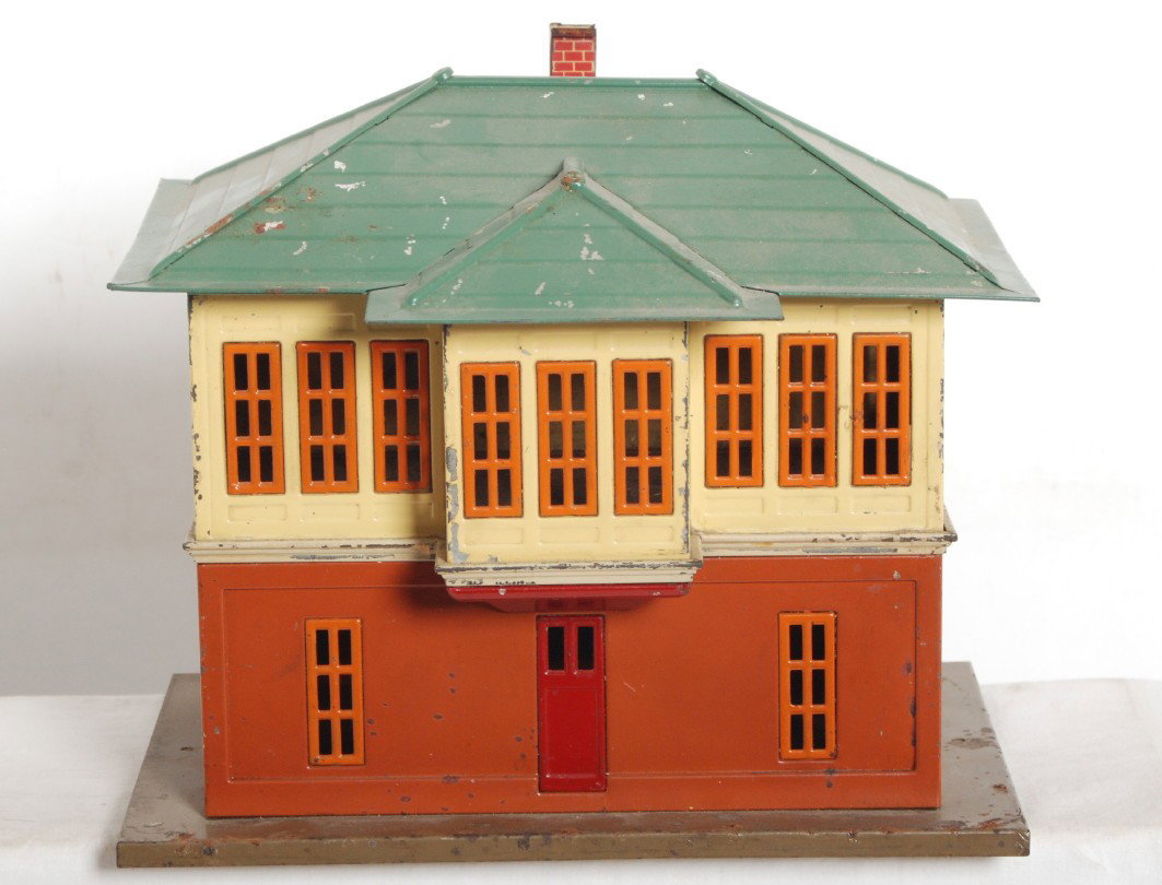 Prewar Lionel No. 437 switch signal tower: Prewar Lionel No. 437 switch signal tower with older repainted roof, C5-6 with instructions on underside of frame. Chimney is missing three flanges.