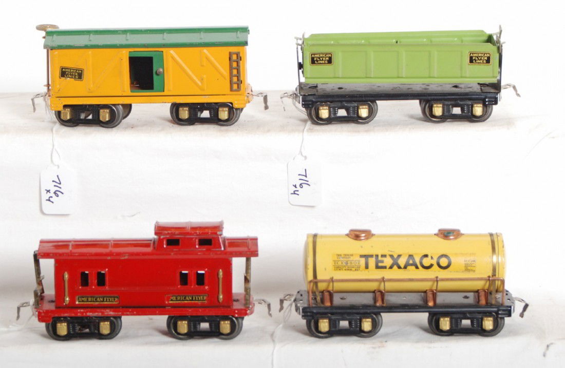 American Flyer O gauge ballast, box, tank, caboose: Prewar American Flyer O gauge freight cars, clean and shiny C6 area. Side dump ballast car, boxcar, Texaco tank car, and caboose.