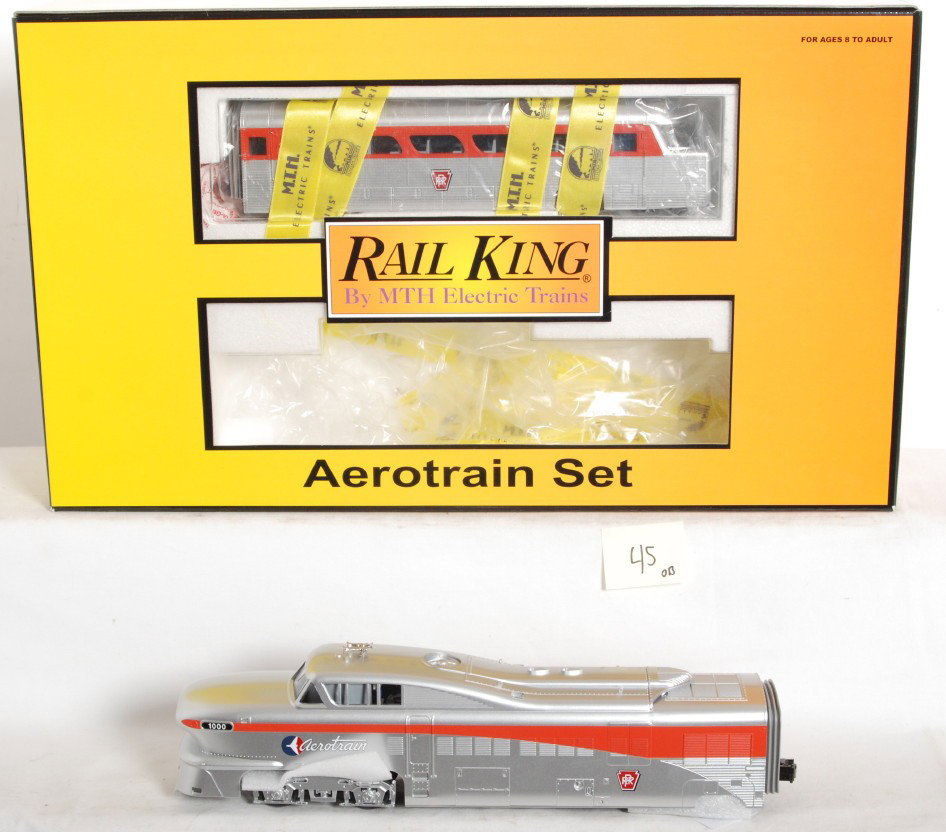 MTH Railking Pennsylvania Aerotrain set: MTH Railking modern O Gauge Pennsylvania Aerotrain set in OB. Catalog number is 30-2210-1. Set features Protosound 2.0 with DCS control. Set box has some very light corner and edge wear along with pri