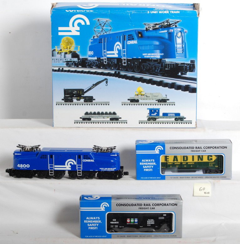 K Line Conrail GG1 safety set and extras: K Line modern O Gauge Conrail GG1 safety award set in OB. Locomotive catalog number is K2707-4800. Set includes four other work train cars. Two extra safety cars include K621-9012 hopper and K644-1935