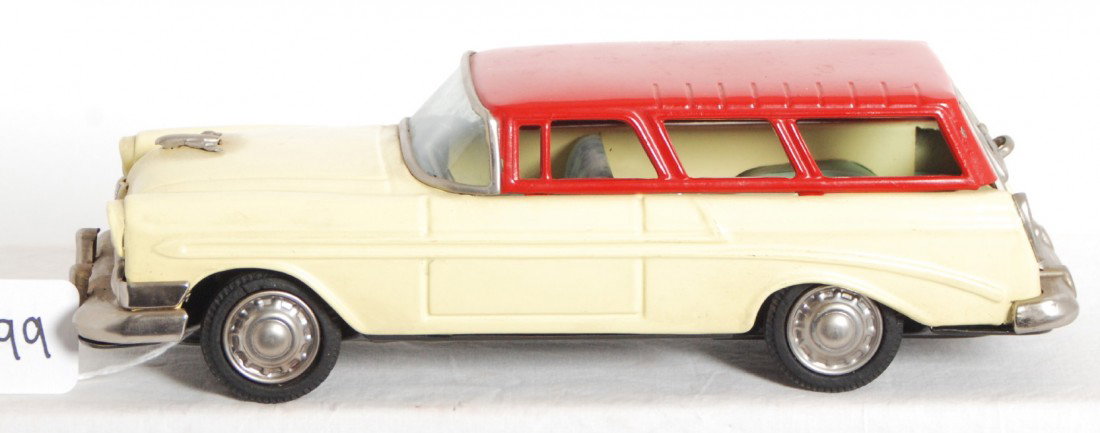 Bandai Ford station wagon friction powered tinplat: Bandai Japanese friction powered tinplate Ford station wagon in original C8 condition. Vehicle may clean and polish to look a little better. 95 percent or better paint. Car measures approximately 9-3/