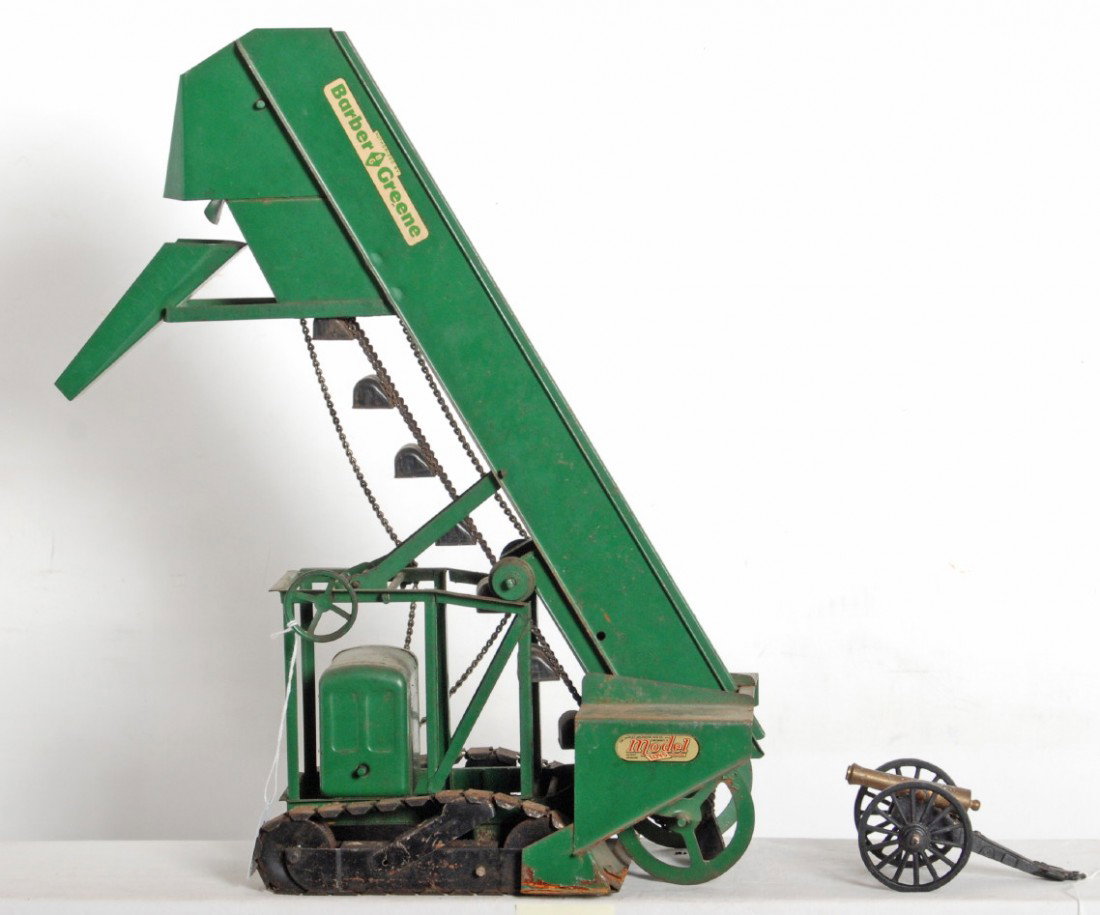 Doepke Model Toys 22 inch sand loader Barber and G: Doepke Model Toys 22 in sand loader with some light surface rust hear and there, C7. Also included is a brass cannon on diecast frame marked G 1/2 MFCO. Overall length is 5 inches.