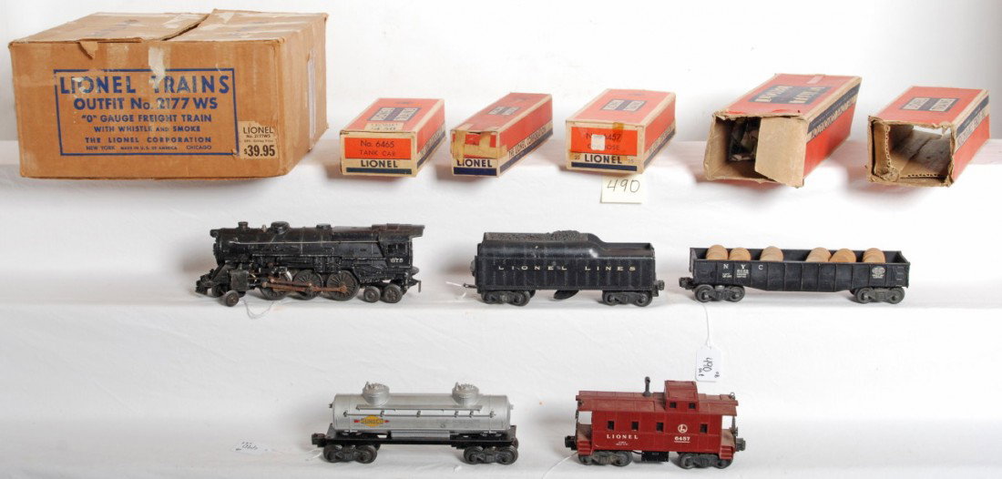 Lionel 2177 freight train w/whistle and smoke in O: Postwar Lionel outfit No. 2177WS O gauge freight train with whistle and smoke in original boxes. Trains consist of 675 steam loco, 2046W whistle tender, 6465 Sunoco tank, 6462 New York Central gondola