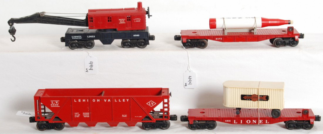 Lionel 6175, 6810, 6436, 6560 Hagerstown: Postwar Lionel O gauge freight cars, 6175 flatcar with rocket (Lionel is painted out with red paint), 6810 flatcar with Cooper Jarrett trailer, 6436 Lehigh Valley hopper, 6560 Hagerstown operating wor
