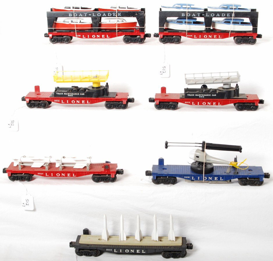 Lionel 6844, 3419, 6823, 6812, 6812, 6416, 6416: Postwar Lionel O gauge 6844 missile carrier, 3419 helicopter launching flatcar, 6823 flatcar w/rockets, two 6812 track maintenance cars (one has lemon yellow superstructure) both have a broken crank, 
