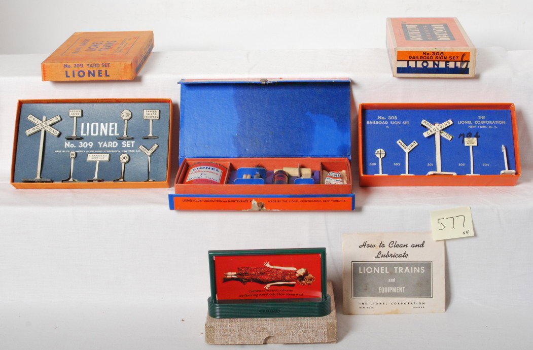 Lionel 927, 308, 309, Fortel billboard in OB: Postwar Lionel O gauge 927 lubricating and maintenance kit, 308 railroad sign set, 309 yard set, Fortel Carpet billboard and frame, all in original boxes. Accessories look C8-10. Boxes show little wea