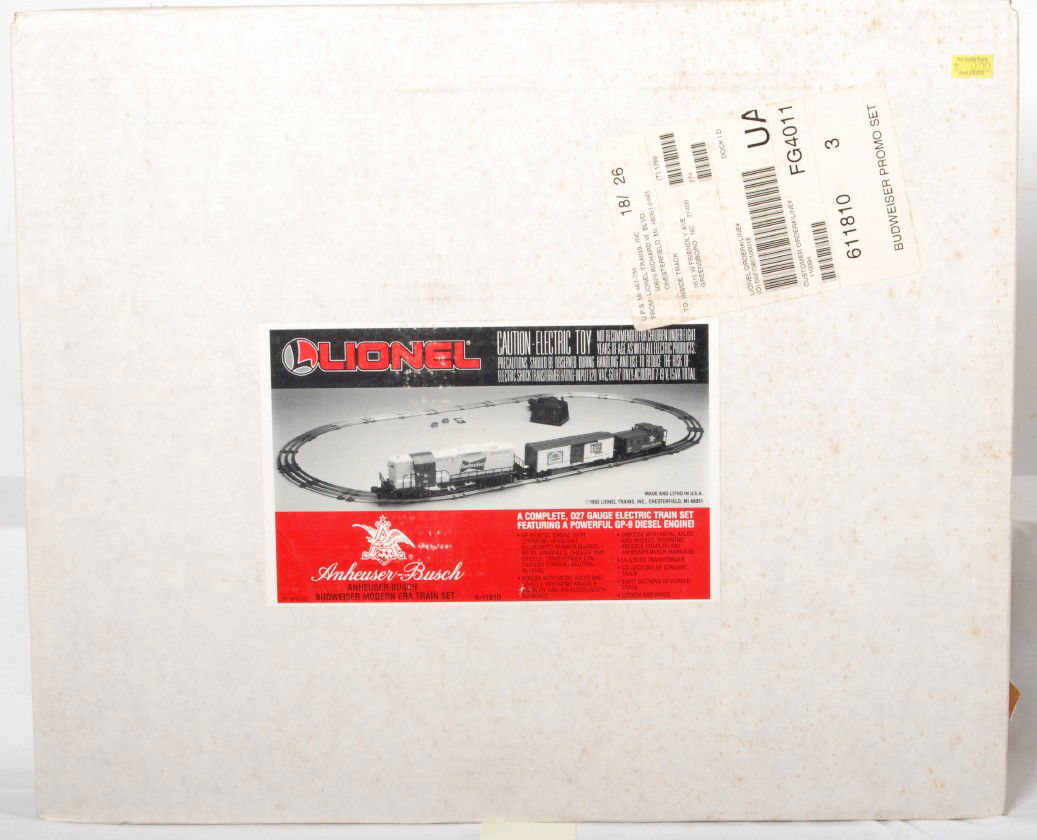 Lionel 11810 Anheuser Busch set: Lionel modern O gauge 11810 Anheuser Busch train set in OB. Set has been opened, but is complete. Loco has a very light roller mark. Set might have been used once or twice. Overall C8. OB has shipping