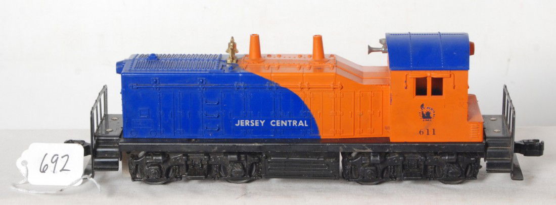 Lionel No. 611 Jersey Central NW-2 diesel switcher: Postwar Lionel O gauge No. 611 Jersey Central NW-2 diesel switcher, screw crack C6. Should clean to look a little nicer.