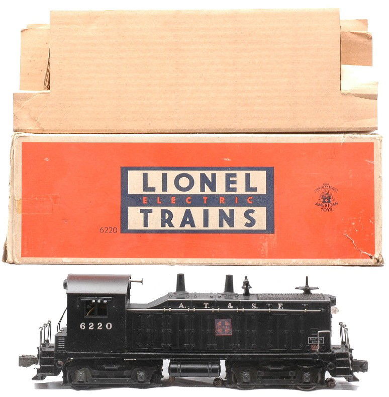 Lionel 6220 AT&SF Diesel Switcher Boxed: Lionel postwar 6220 AT&SF NW2 bell ringing diesel switcher in OB with original cardboard insert. This is the version with ten stanchions and a small GM decal. The switcher is C7. The OB shows wear and