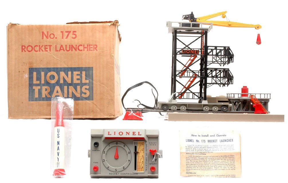 Lionel Postwar 175 Rocket Launcher Boxed.: Lionel postwar 175 rocket launcher in OB with instruction sheet, controller and rocket, C6-7. The box is worn with tape repair.