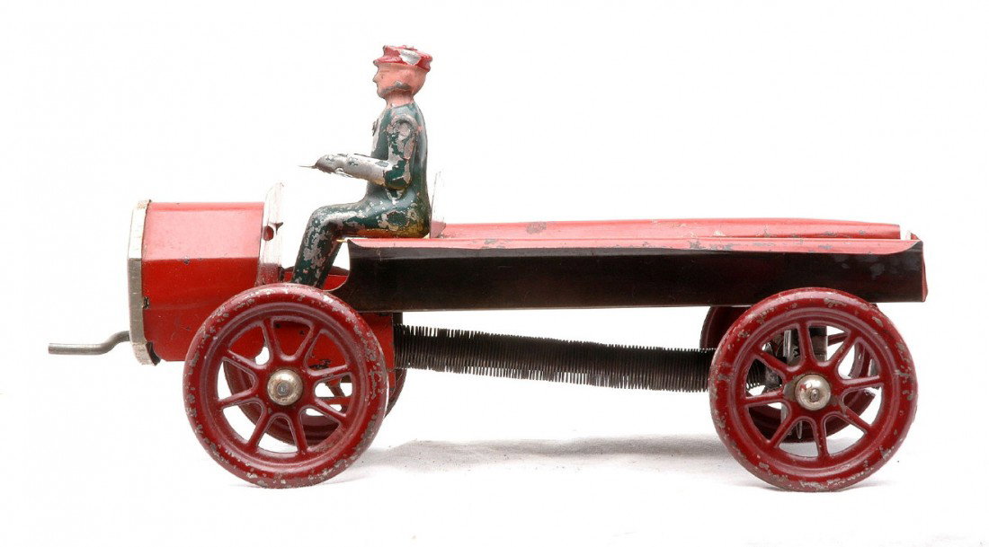 A.C. Gilbert Tin Red ÒGilmotorÓ Wind Up Truck: A.C. Gilbert tin red ÒGilmotorÓ wind up truck with spoke wheels that measures 9 inches in length, C6.
