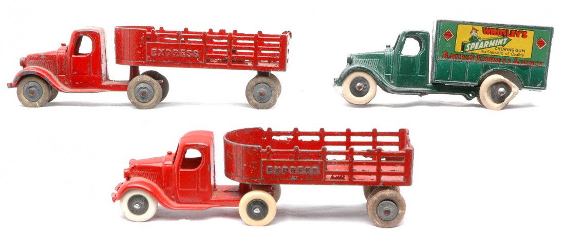 TootsieToys 0801 Mack Stack 0810 Wrigleys Gum: TootsieToy two red 0801 Mack Express stake trucks one with six wheels and the other with eight wheels. The cab on the truck with eight wheels appears to have been repainted. Also included is a 0810 Ma