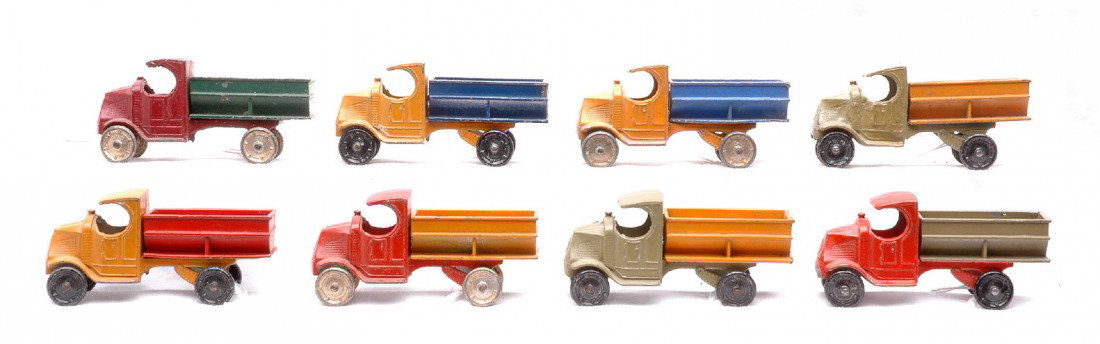 TootsieToy eight 4639 Mack Coal Trucks: TootsieToy eight 4639 Mack coal trucks in various color combinations that each measure 3 1/4 inches in length. The trucks are C6.