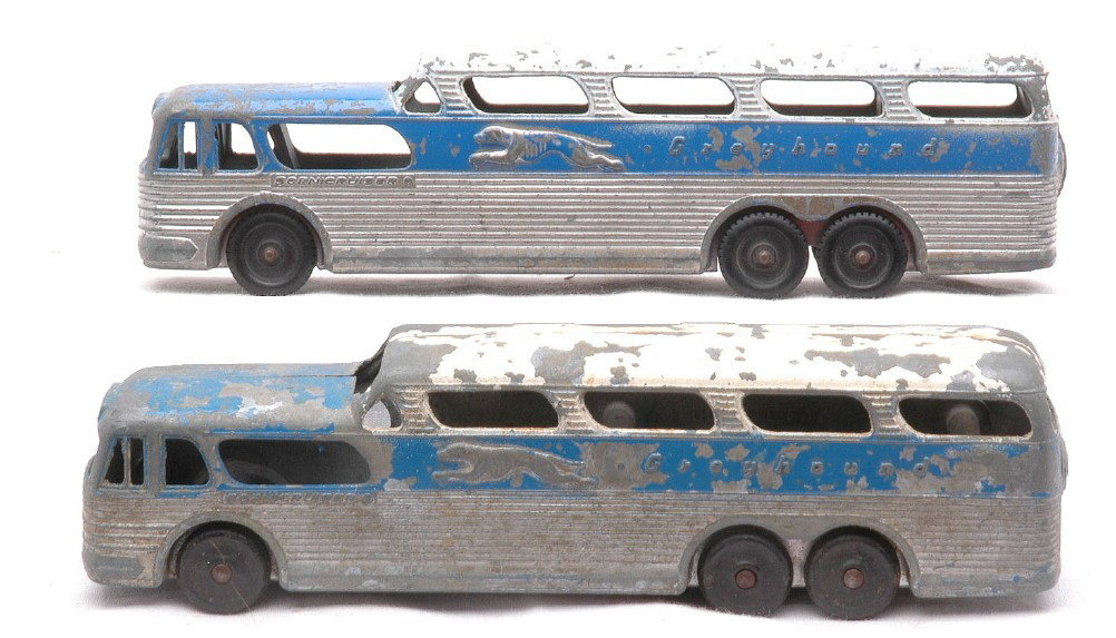 TootsieToy two GMC Greyhound Scenicruisers: TootsieToy two GMC Greyhound Scenicruisers from 1955. Both buses measure 7 inches in length and one bus has a solid bottom. The bus with a solid bottom is C5 and the other bus is C6.
