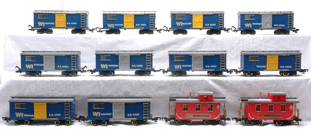 New Bright Western RR 10 Boxcars 2 Cabooses: New Bright G scale ten blue Western R.R. Lines boxcars and two Western R.R. Lines cabooses. The cars have shelf dust and are C7.