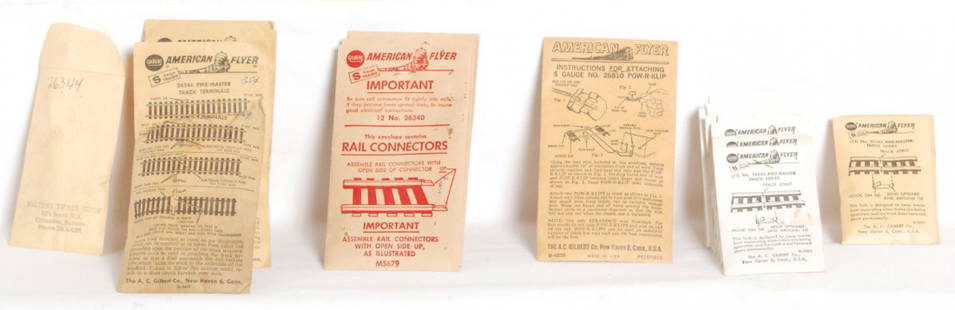 American Flyer parts envelopes with parts: Postwar American Flyer S gauge parts envelopes with some parts in some. Some are factory sealed. Four M-5391 12 No. 26343 Pike-Master track locks, ten M5357 Pike-Master adapter pins, two 26343