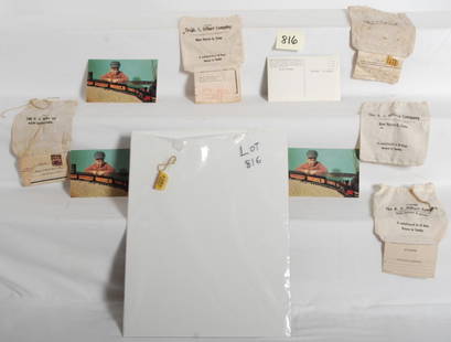 AC Gilbert postcards, mailing bags, and harmonica: Neat collection of AC Gilbert items. Includes five unused post cards featuring the American Flyer Frontiersman set, AC Gilbert harmonica, and five mailing sacks. Items range C9 to C7.