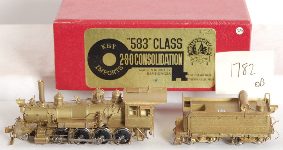 Key Imports D&RGW 2-8-0 steam locomotive: Key Imports modern HO Denver Rio Grande and Western brass class 583 2-8-0 consolidation OB. Loco is C8 however loco has some red dye transfer from the foam insert. OB and tender have small marking sti