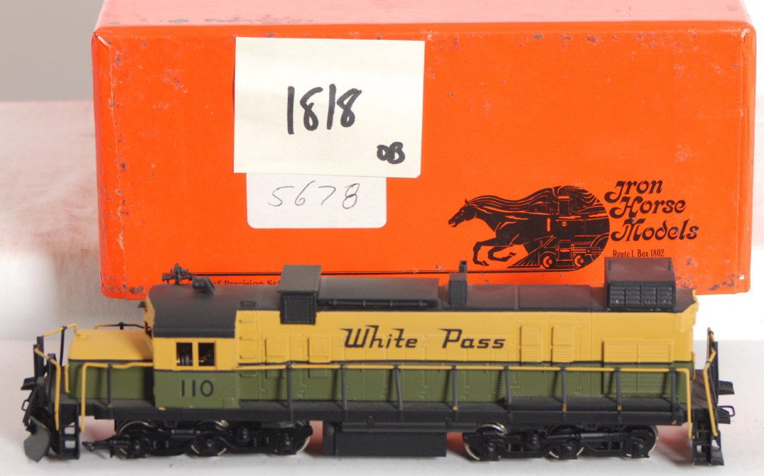 Iron Horse White Pass and Yukon diesel: Iron Horse / Precision Scale Co. modern HOn3 brass White Pass and Yukon Alco diesel locomotive in OB. Looks to be a Alco 251d, not completely sure. Loco is C8-9 with very little run time. OB has two m