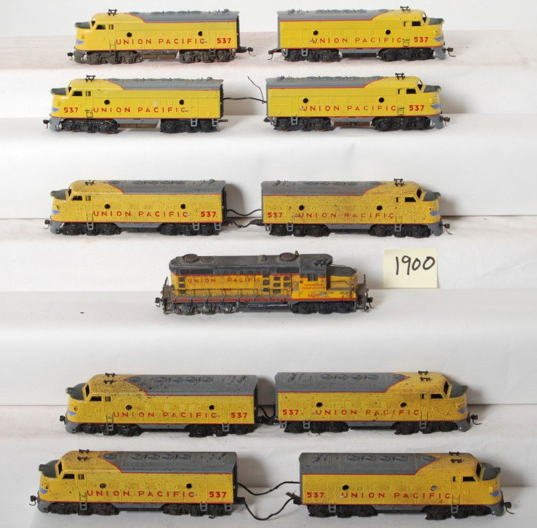 11 HO Union Pacific diesel locos: Modern Mantua HO F7 Union Pacific locomotives. Ten F units and one SD series diesel loco. Most have been weathered with Kadee couplers. C7 area. See photos for best description.