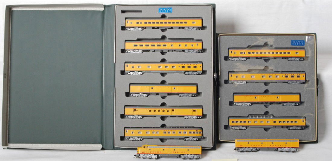 Kato Union Pacifc E8 A-B 10 pass cars: Kato modern N scale Union Pacific E8 diesel A-B set and nine passenger cars in OBs. Passenger car sets are 106-014 and 106-024. Cars and locos are C8 condition, a few small detail parts missing from c