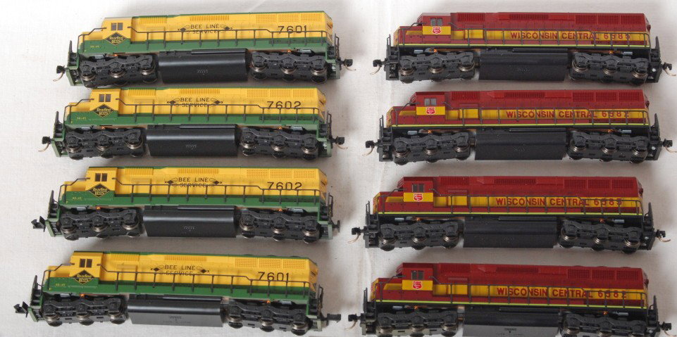 8 Kato SD45 Reading and Wisconsin Central: Eight Kato modern N scale SD45 diesel locomotives. Includes four Reading and four Wisconsin Central. All locos missing horns, A mix of Kadee and hook couplers. See photos for best description. C8.