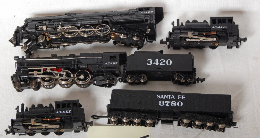 4 Santa Fe steam locomotives Bachmann etc: Santa Fe modern N scale steam locomotives from Bachmann and Trix. Bachman loco is a 4-8-4, Trix is a 4-6-2, and two 0-6-0 switchers included . Generally C8, Bachmann loco has Kadee coupler